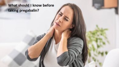 Neck pain of a young woman sitting at home.